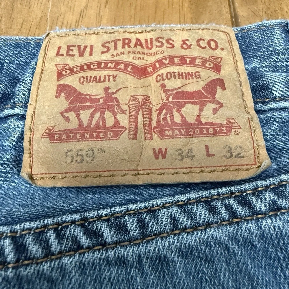 Levi's 559 jeans men's 34x32 dark wash blue denim relaxed straight Levi Strauss